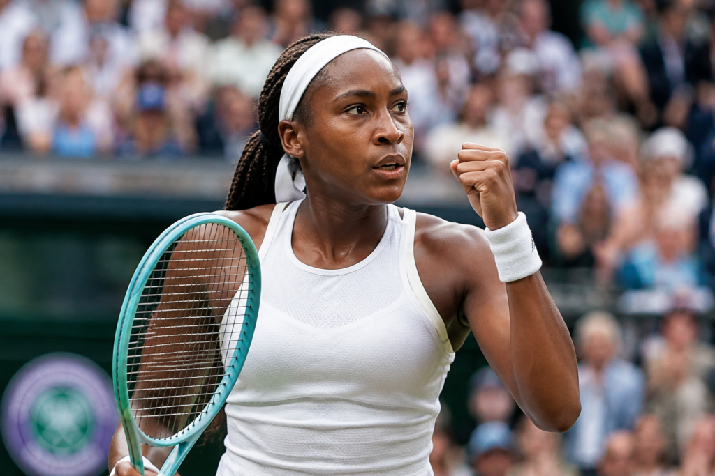 Coco Gauff Breaks Through on Grass, Reaches First Wimbledon Semifinal Coco Gauff celebrates a point during a Wimbledon match on the grass courts while holding her tennis racket.