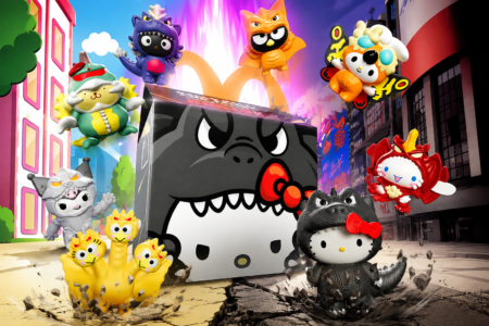 Hello Kitty x Godzilla Happy Meal toys in a kaiju-themed city scene